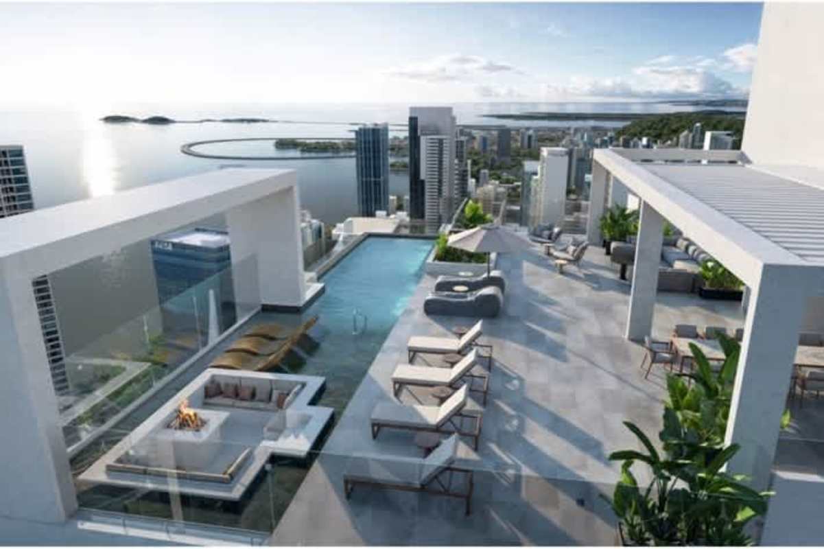 Bright modern children's playroom with slide ball pit floor-to-ceiling windows at PH Costanera Aqua