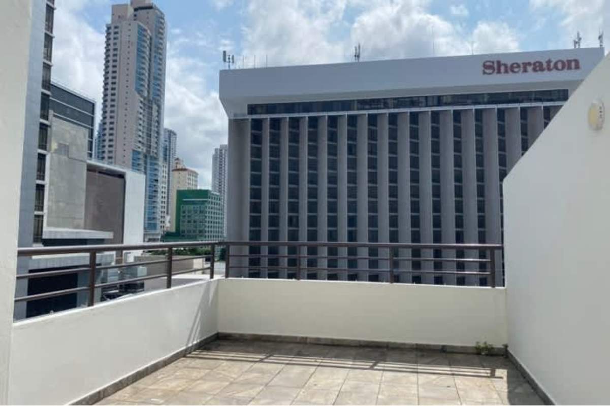 Balcony with tile floor railing overlooking Panama skyline PH San Francisco Bay