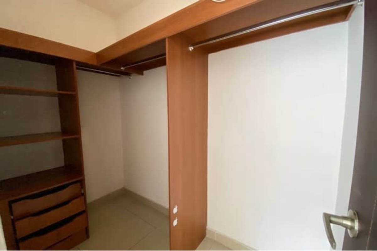 Walk-in closet with wood shelves, drawers in PH San Francisco Bay Panama