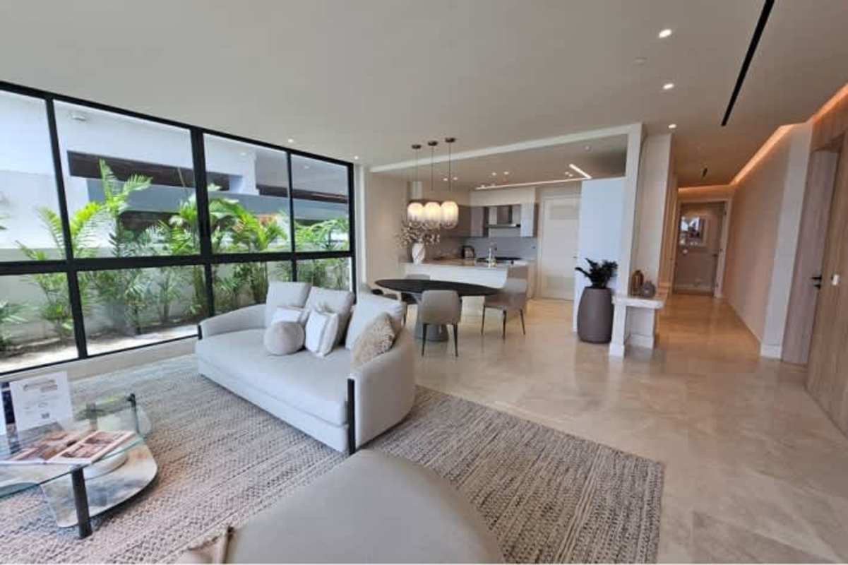 Modern open kitchen and dining space with full ocean views at Ocean Reef Islands Punta Pacifica