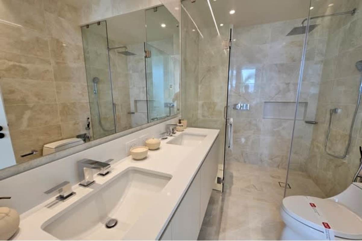 Luxury bathroom with marble finishes and double sink vanity at Ocean Reef Islands Panama