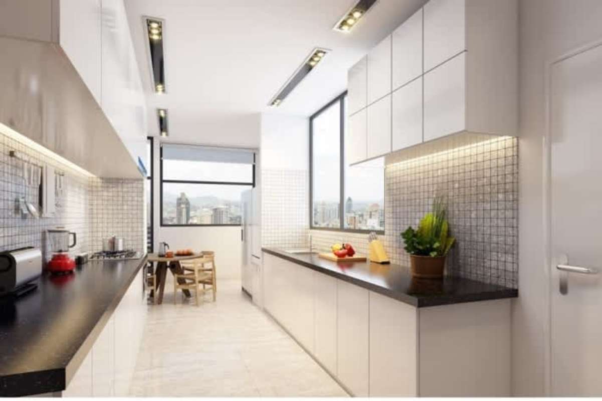 Sleek contemporary kitchen with large window black countertops white cabinets PH BICSA Panama