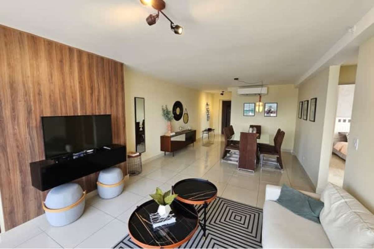 Open concept living dining area with large windows and ocean views in PH BICSA Financial Center Panama