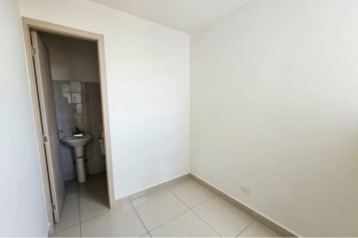 Bedroom with large windows, ocean and city view in luxury PH BICSA Avenida Balboa Panama