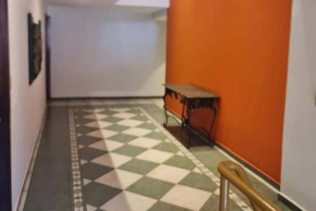 Interior corridor with ceramic tile floors and neutral walls inside office for rent Panama