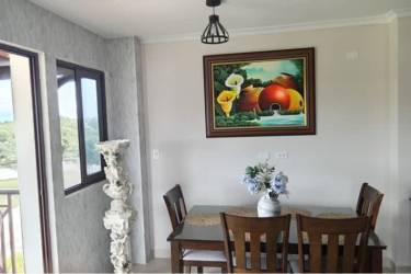 Open dining and living room in beach apartment PH Brisas de Coronado