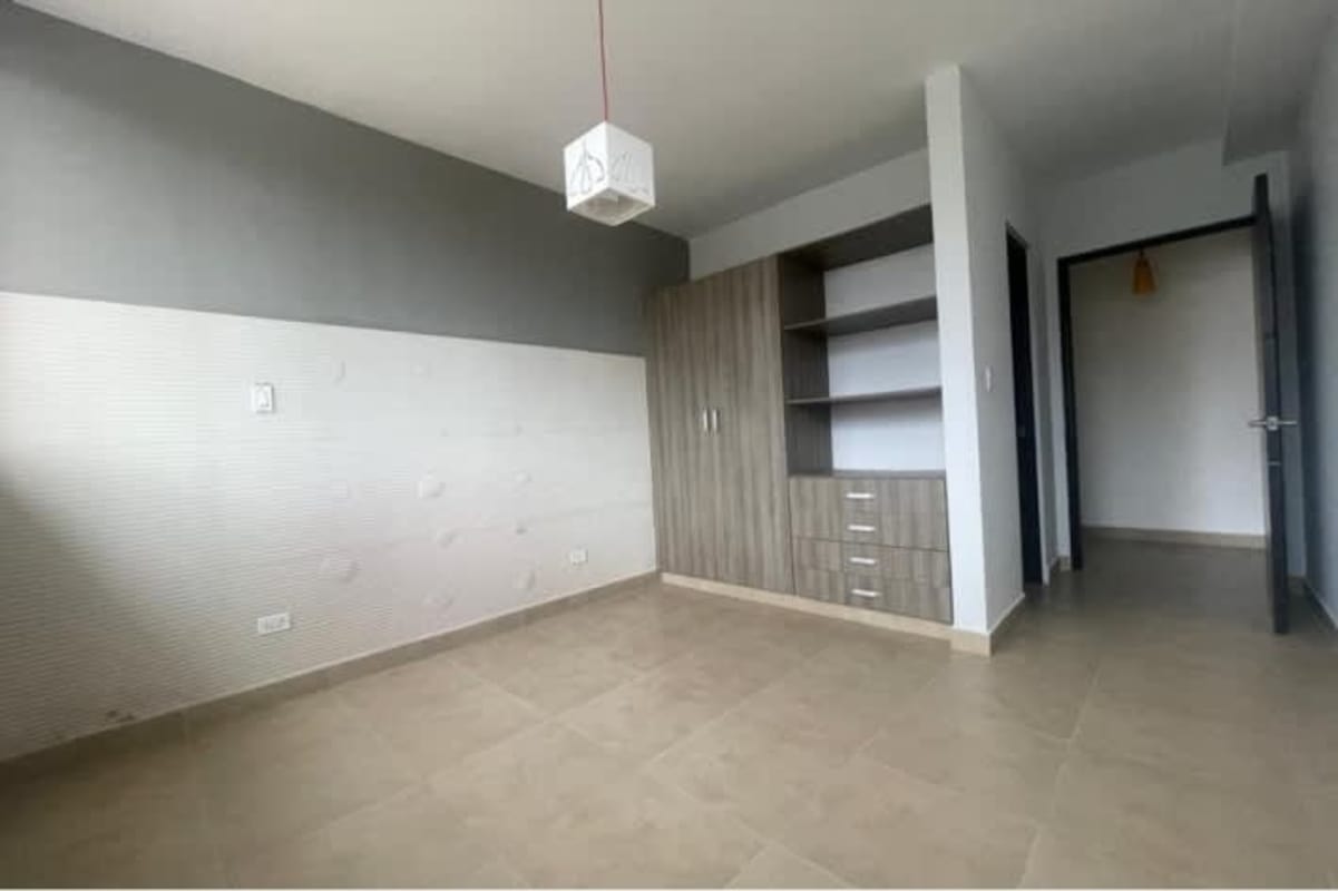 Empty bedroom with large window and built-in closet in PH San Francisco Bay Panama City