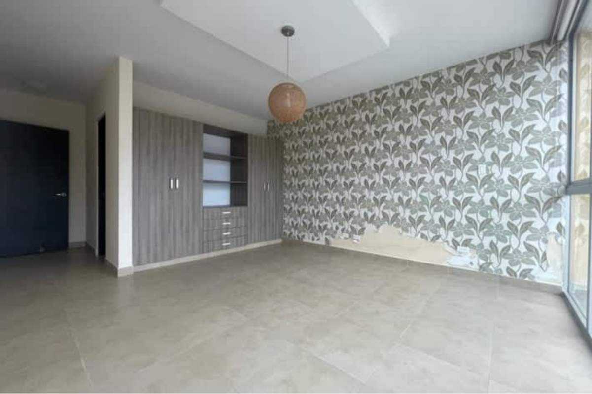 Bedroom with accent wall and tile floor PH San Francisco Bay Panama
