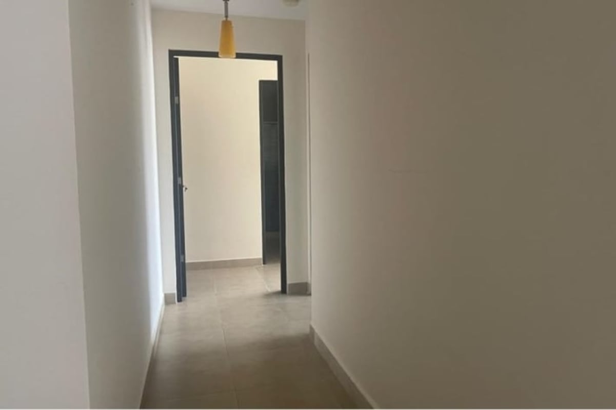 Minimalist hallway with tile floor and neutral walls PH San Francisco Bay Panama