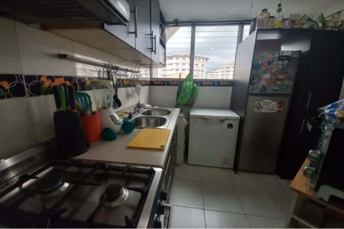 Living area with workstation, sofa, tile floor in Llano Bonito apartment Panama City