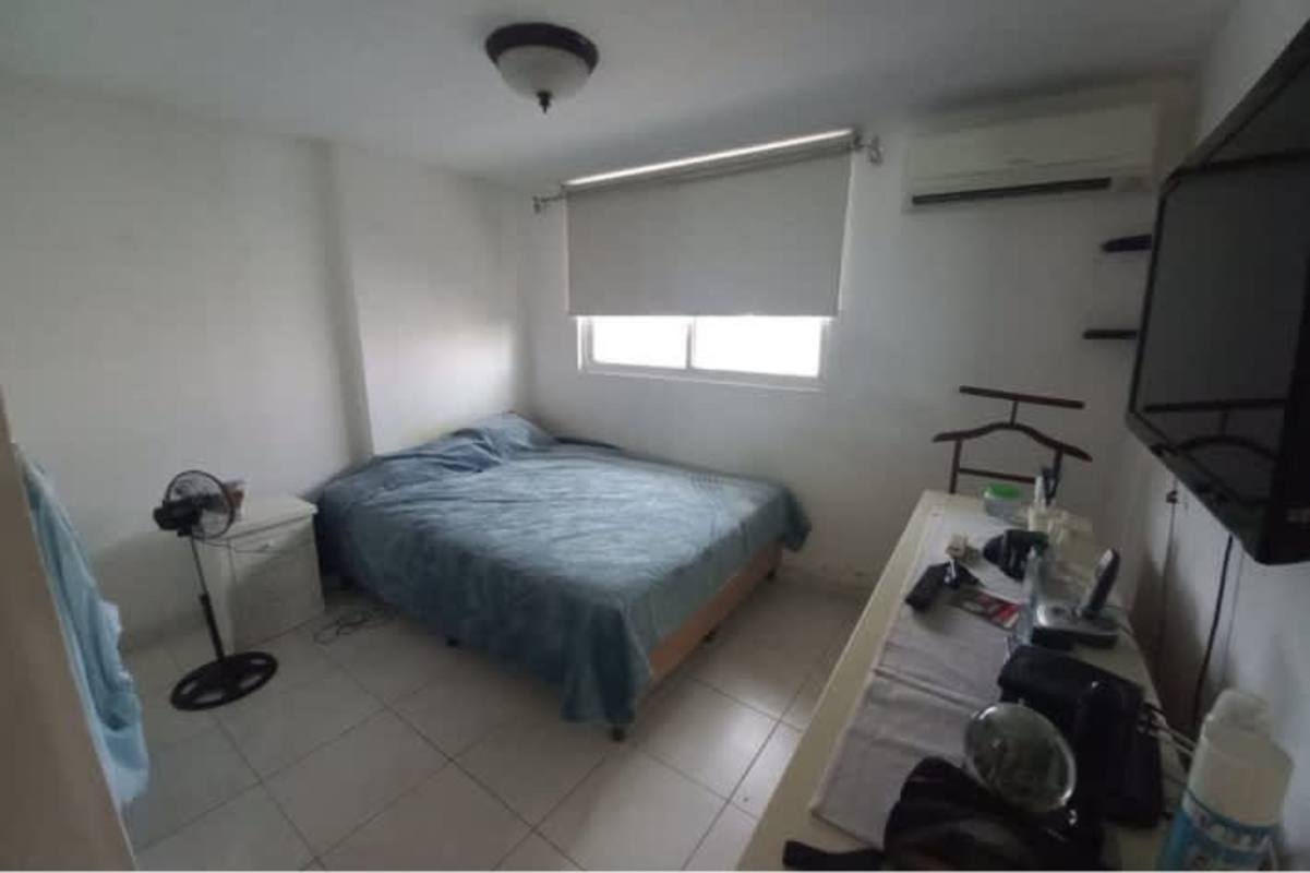 Enclosed balcony with high chairs, windows, and ceiling fan Llano Bonito Residences Panama City