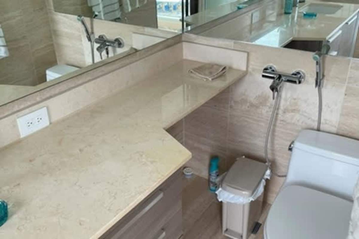 Furnished bedroom with built-in closet and large windows in The Regent Panama City