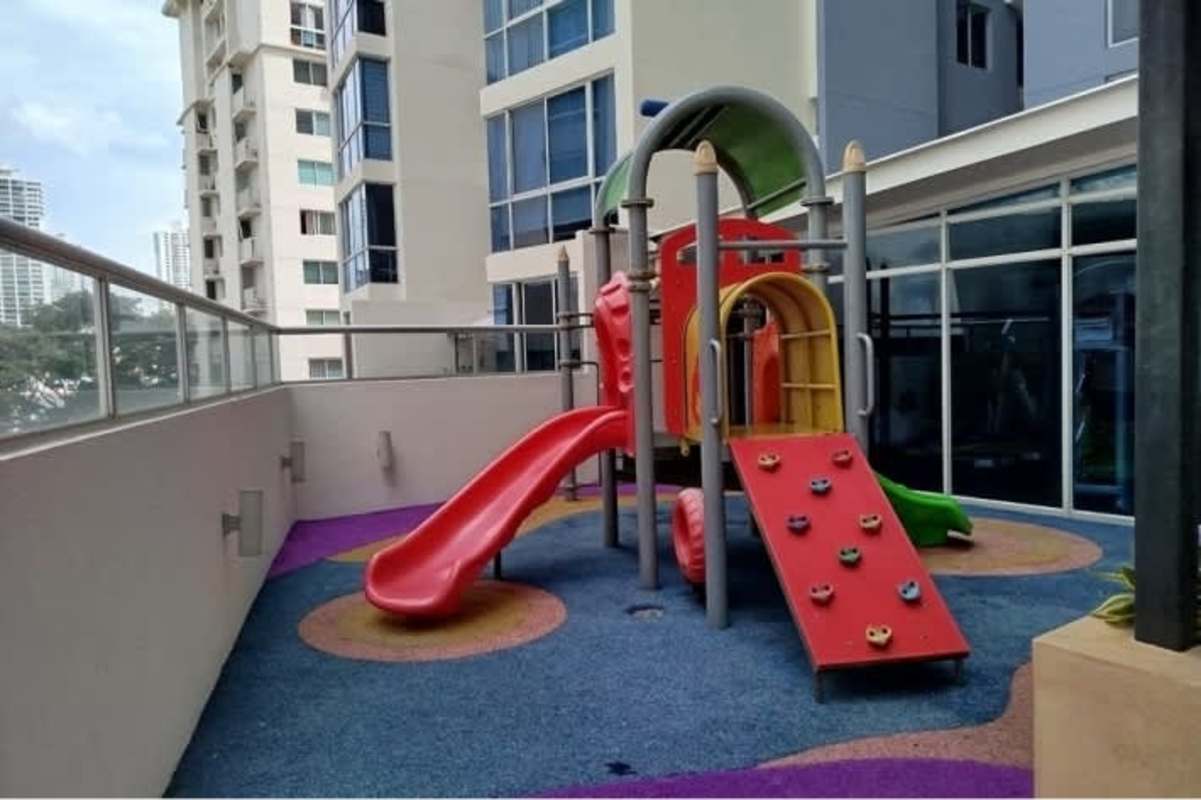 Living area with large windows providing balcony access and city view at PH Carrasquilla Residence Panama City