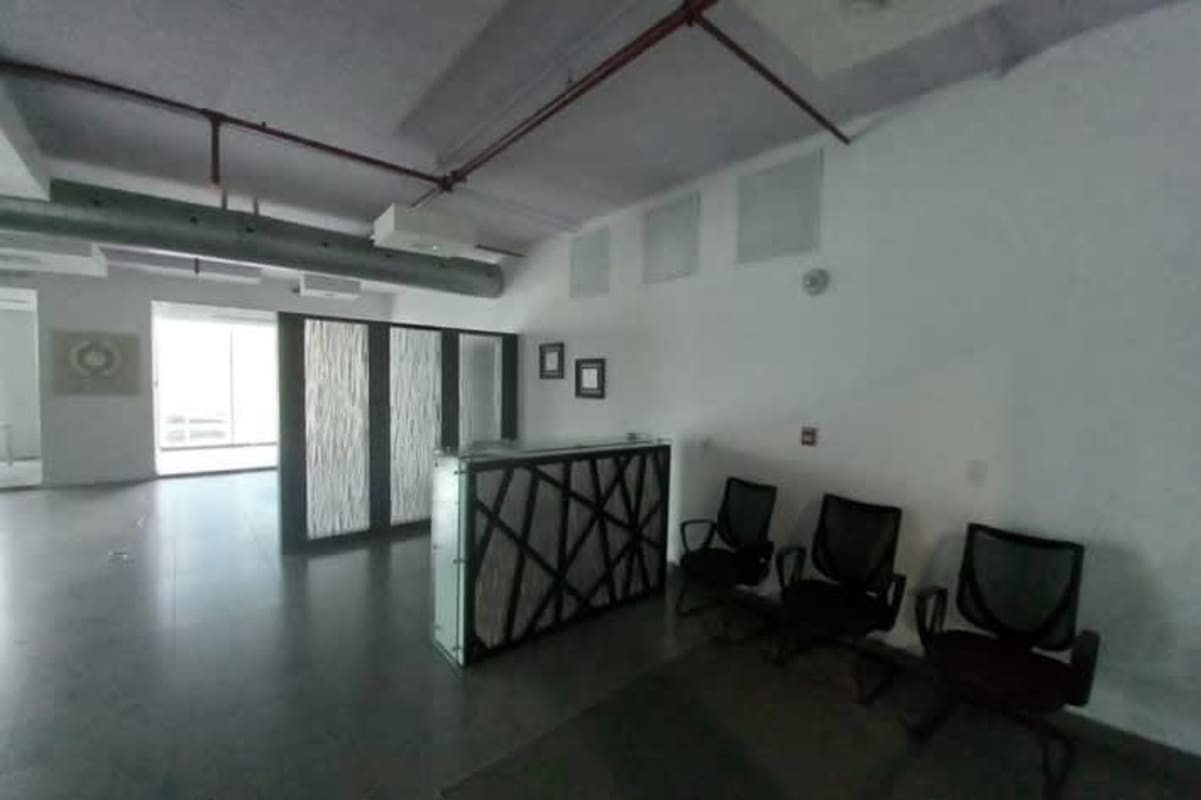 Glass office partition with floor-to-ceiling windows and cityscape views Obarrio PH Office One Panama