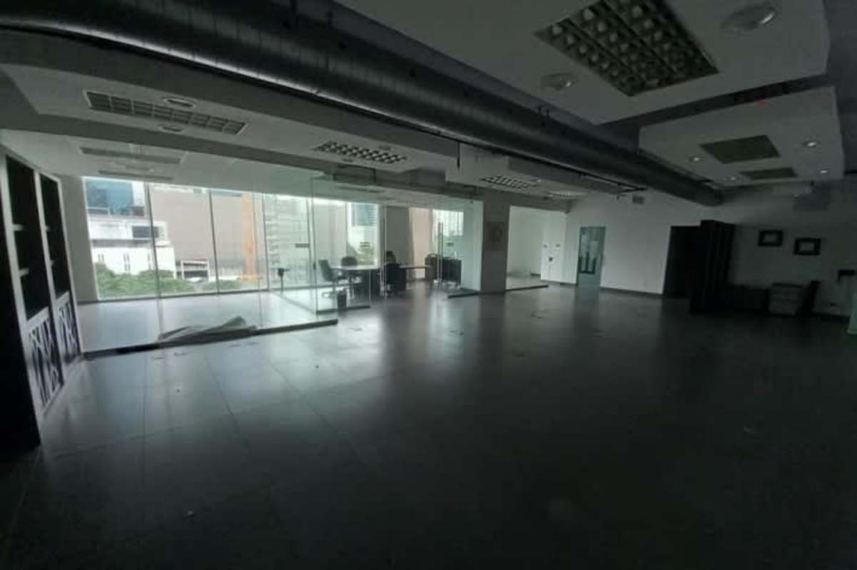 Spacious open office area with large windows city skyline PH Office One Panama
