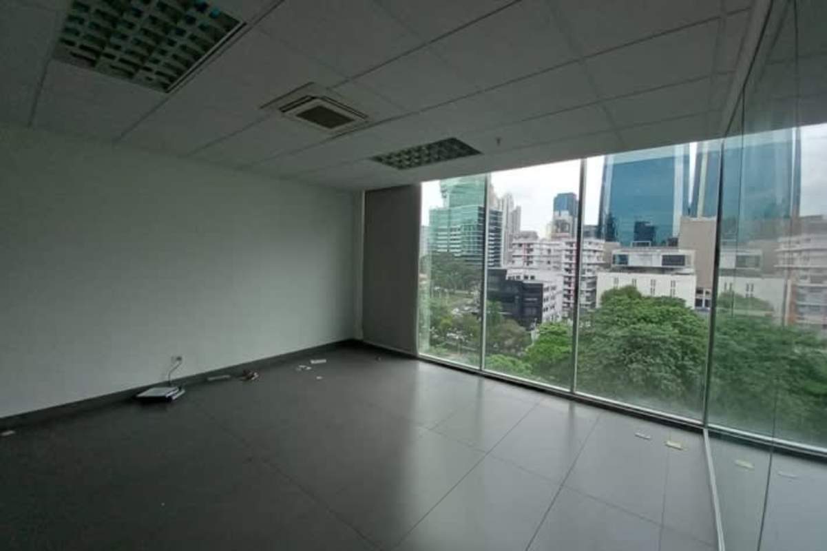 Open workspace with floor-to-ceiling windows city skyline PH Office One Obarrio Panama