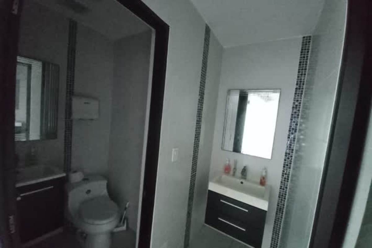 Private office with exposed ductwork glass walls city view PH Office One Panama