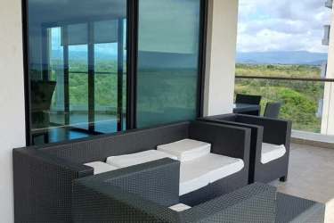 Open plan living dining with large windows ocean golf views Vista Mar San Carlos