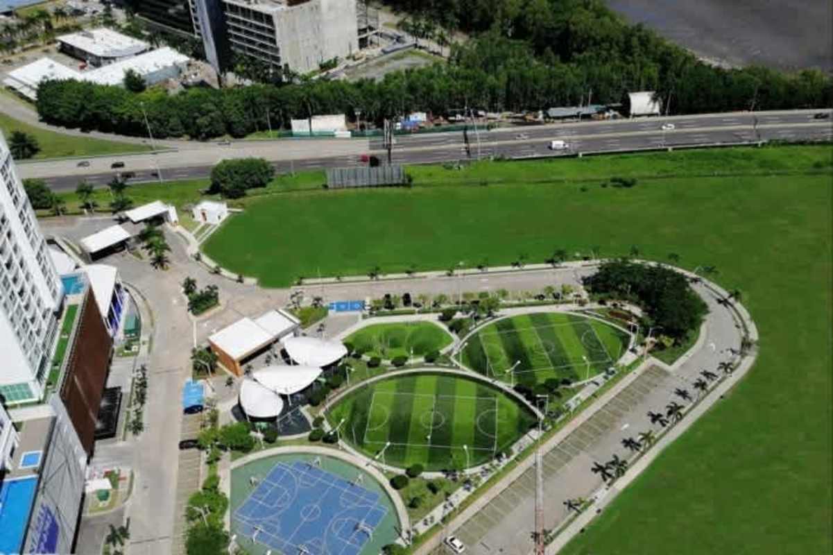 Aerial view multiple sports courts, green parks Costa del Este PH Bali Panama