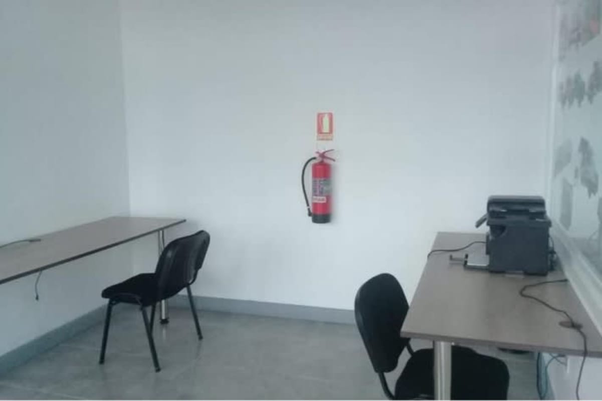 Minimalist office with modern glass dividers overlooking Pacific Ocean in Panama City