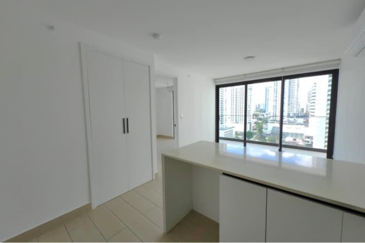 Minimalist bedroom with built-in closet, large windows, city view, Living73 San Francisco Panama