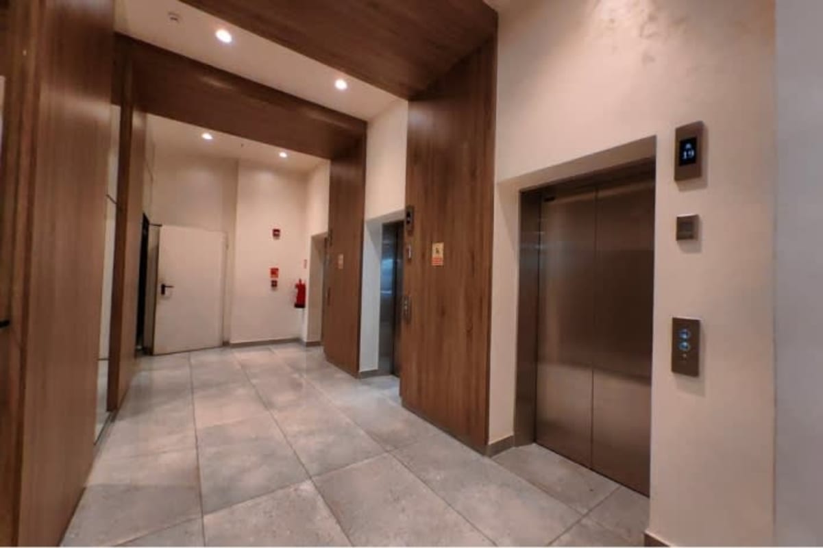 Modern coworking space with floor-to-ceiling windows and city views Living73 Panama