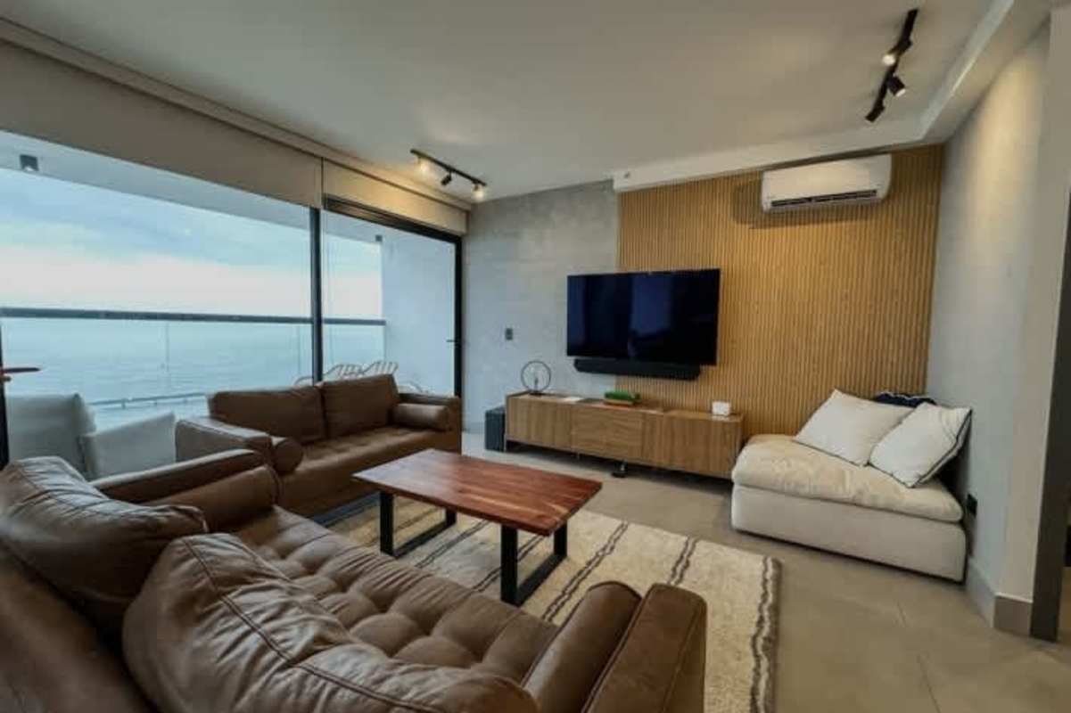 Bright modern dining room with large windows, oceanfront views in PH Ocean Sky Coco del Mar