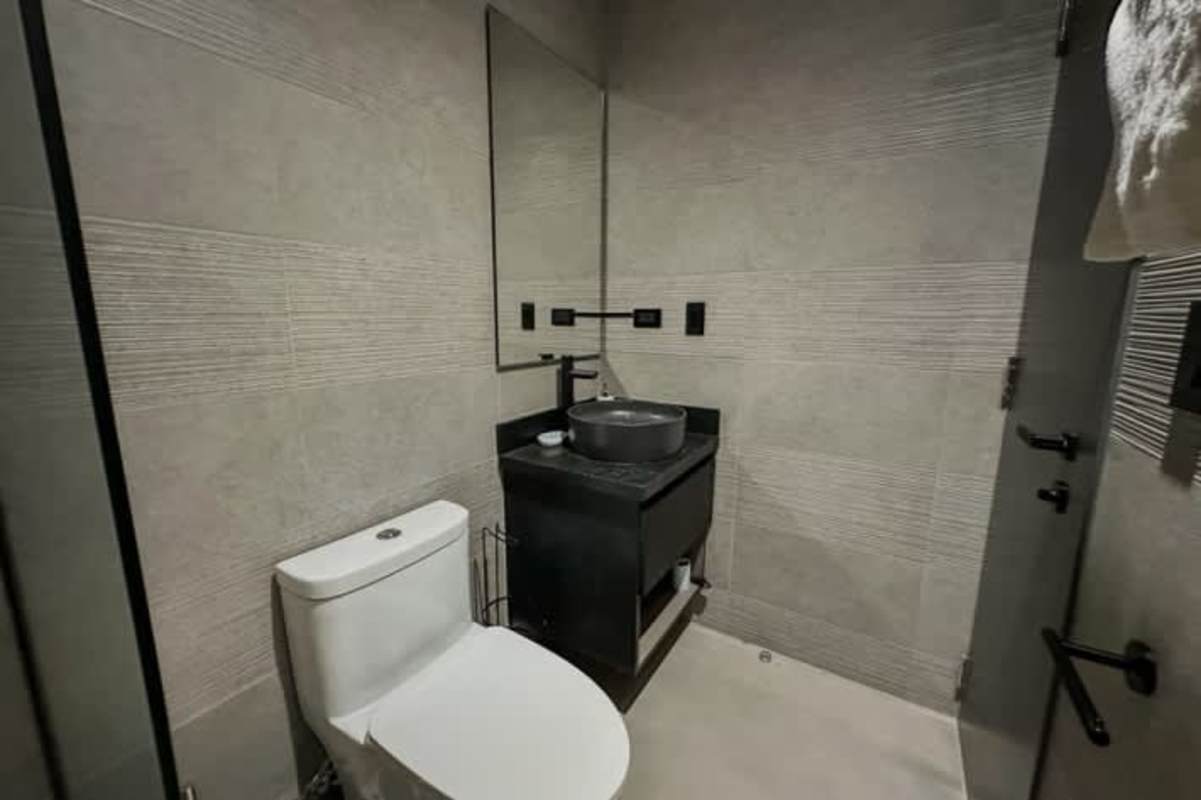 Second bedroom with large window and built-in closet at PH Ocean Sky