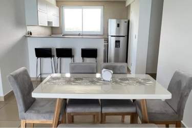 Open dining room with stylish kitchen and large windows at PH Royal Palm San Carlos