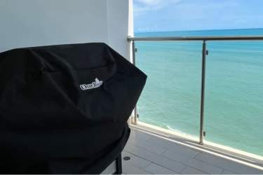 Covered balcony with BBQ grill overlooking Pacific Ocean at PH Royal Palm