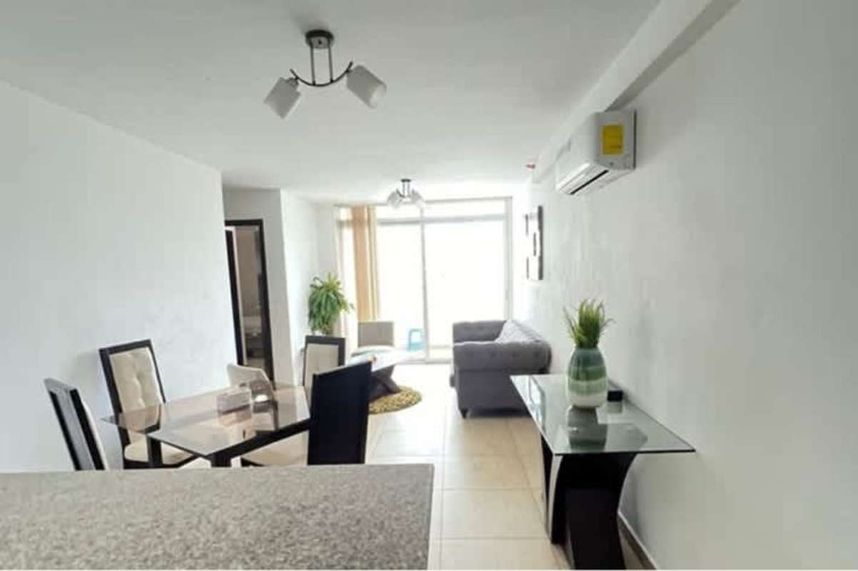 Minimalistic beige bedroom with padded headboard, wardrobe PH Torres de Carrasquilla Panama