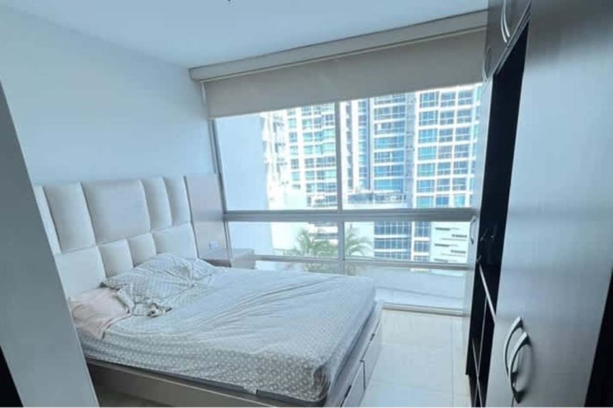 Bedroom with floor-to-ceiling windows, padded headboard PH Torres de Carrasquilla Panama