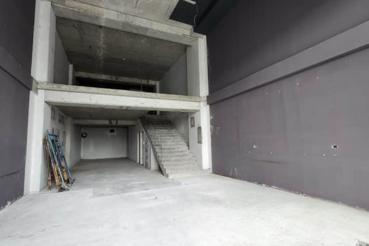 Industrial grey shell unfinished warehouse space with mezzanine potential El Dorado Plaza