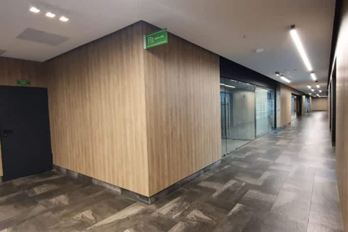 Parking garage and lobby transition with accent walls at El Dorado Business Center Panama City