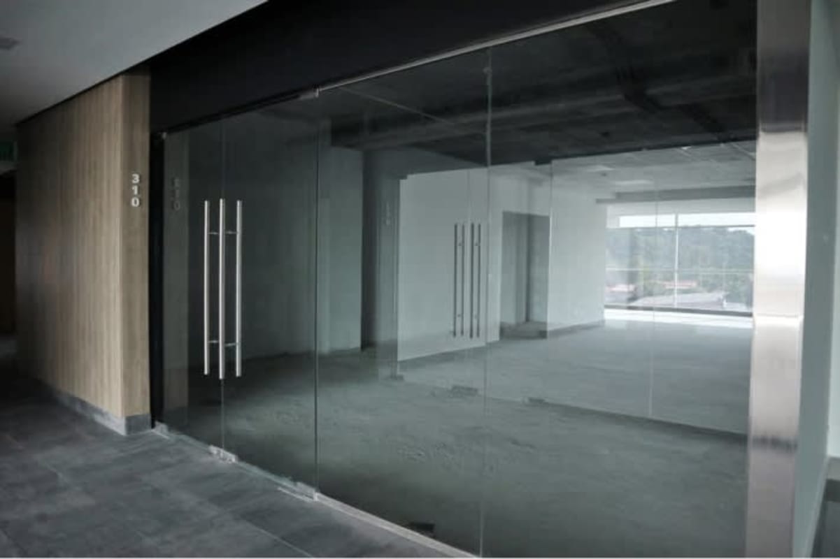 Unfinished shell commercial space with glass doors in El Dorado Business Plaza Panama