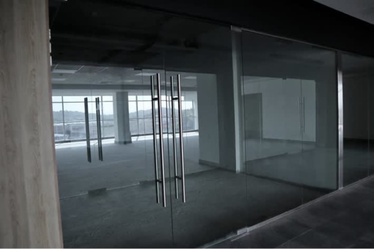 Empty office unit with floor-to-ceiling glass doors and city views El Dorado Panama