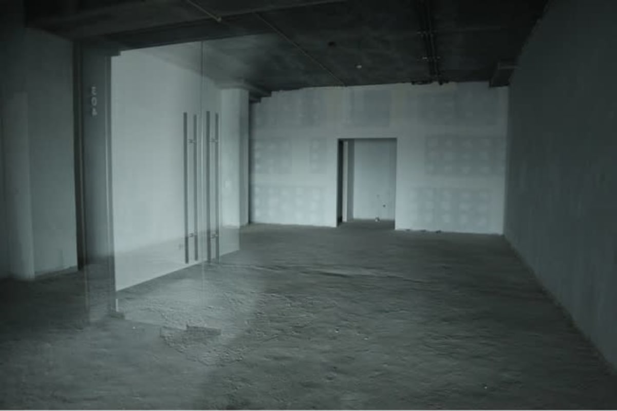 Raw open commercial space with ceiling grid and glass doors in El Dorado Business Plaza Panama City