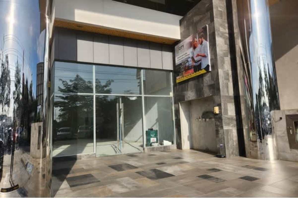 Modern glass storefront with polished metal columns in El Dorado retail plaza Betania Panama City