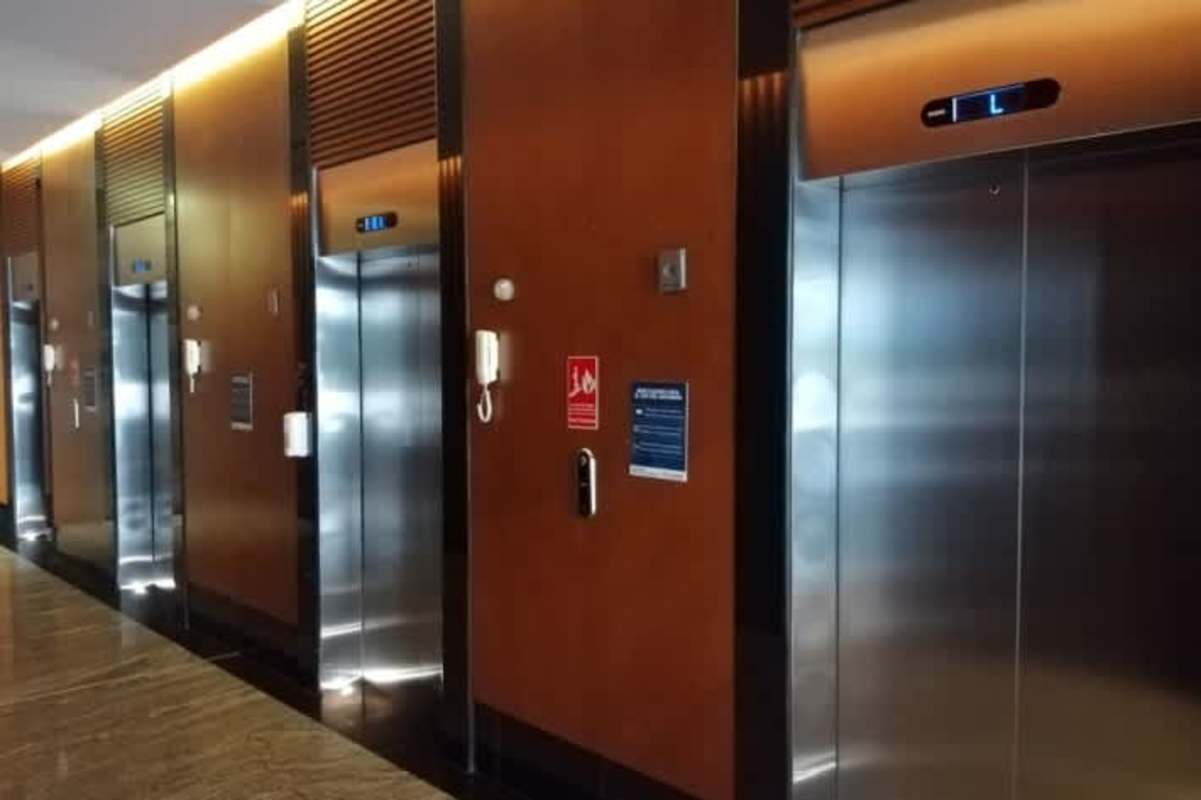 Corporate elevator lobby multiple stainless lifts Santa María Business District Panama commercial lease
