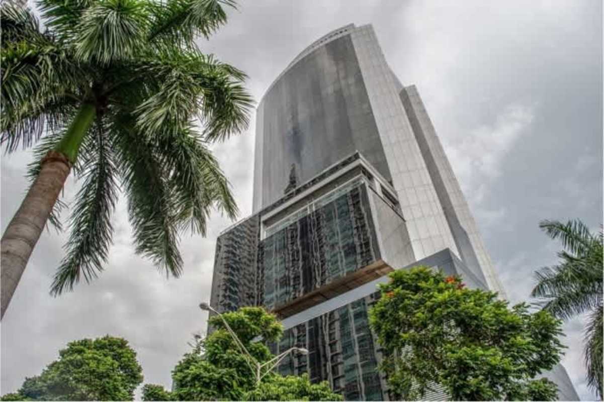 Modern building lobby with marble flooring and elevators at PH Torre Aseguradora Ancón in Costa del Este Panama