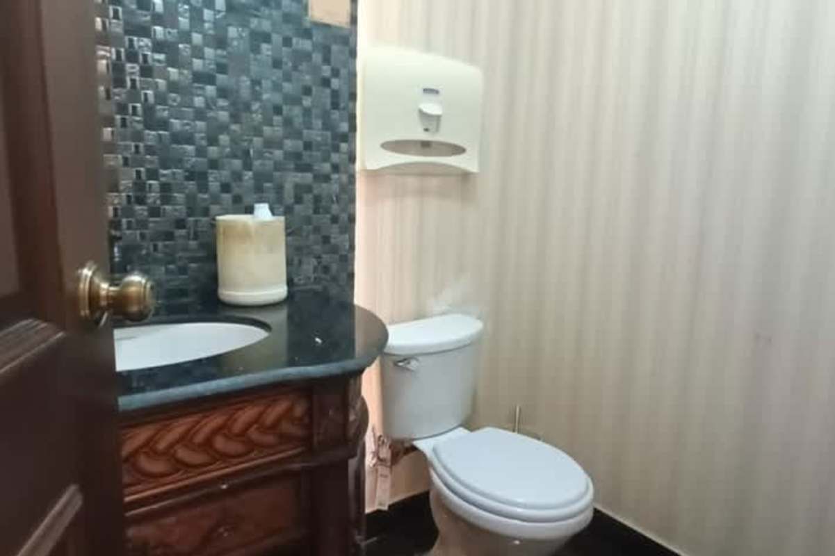 Modern bathrooms with luxury tile fixtures in El Cangrejo commercial rental Panama
