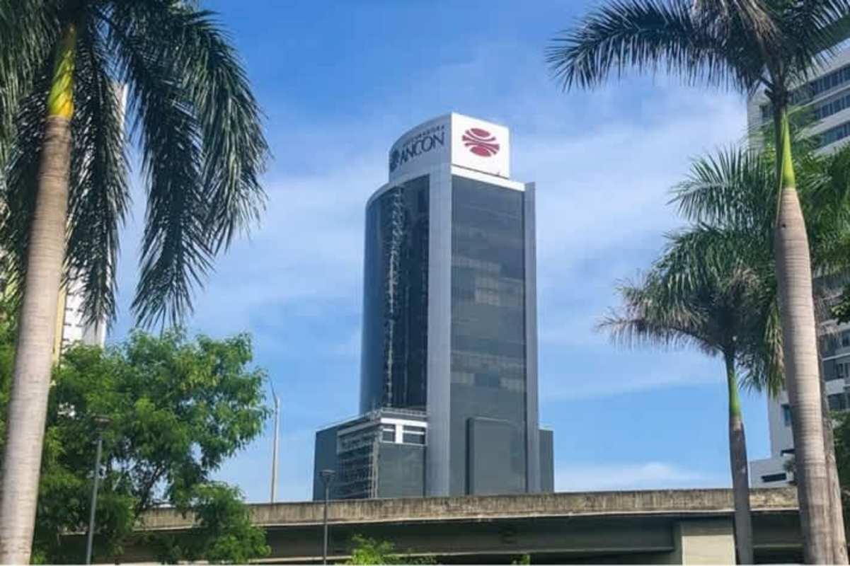 Bright private office with floor-to-ceiling windows and Panama City skyline vista at Costa del Este