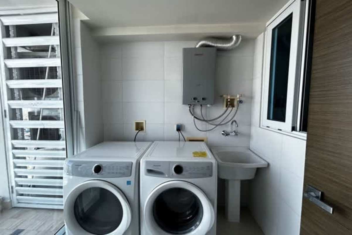 Spacious master bedroom with floor-to-ceiling windows and ocean view Costa del Este Panama