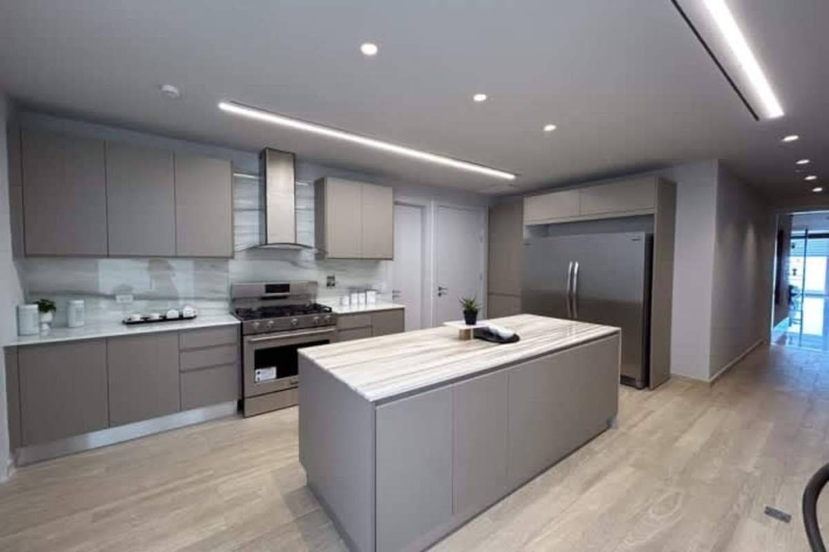 Fully equipped modern marble kitchen in PH Punta Paitilla luxury condo Panama