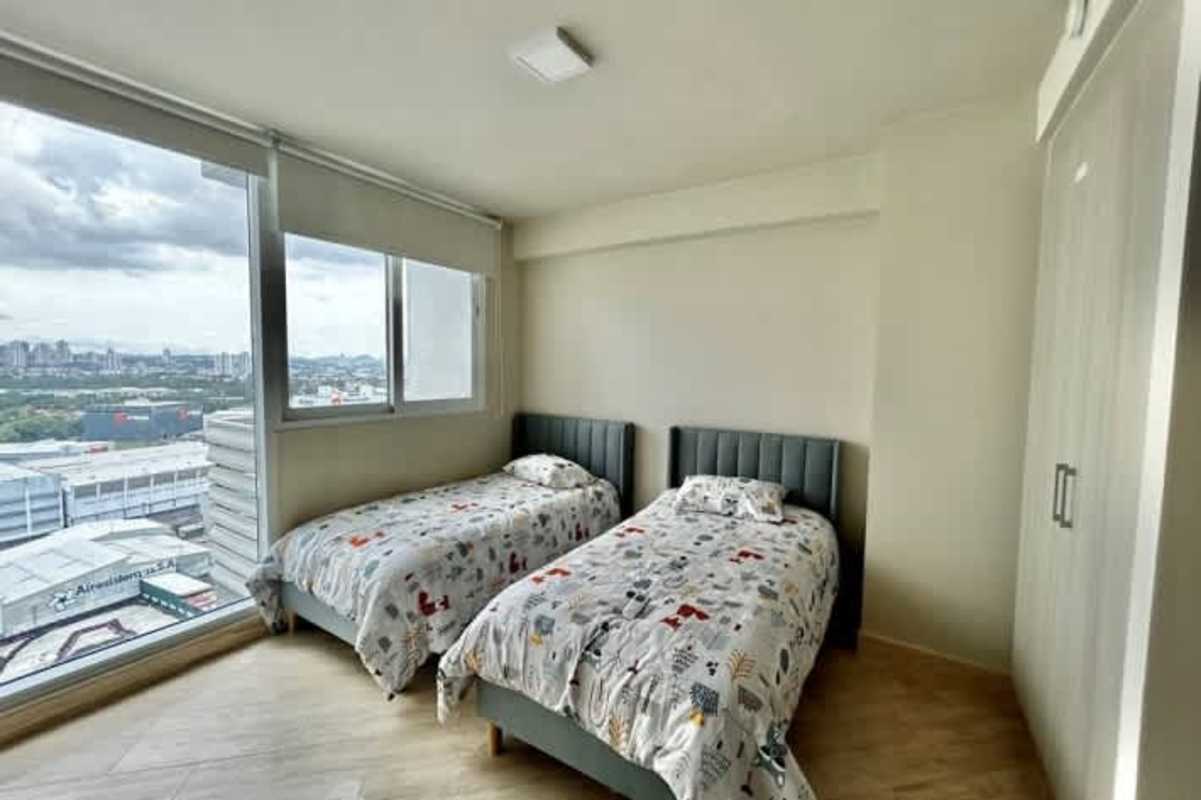 Elegant master bedroom with ocean views, large windows in PH Pacific Point Panama City