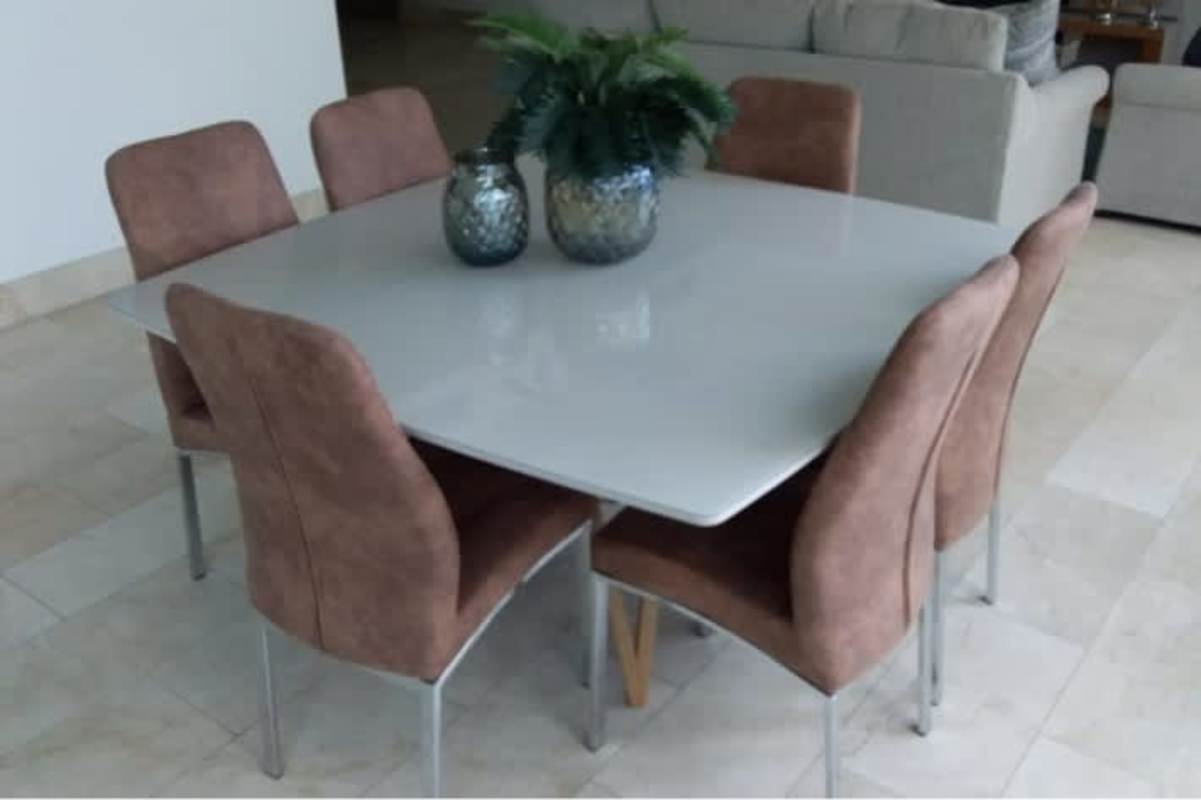 Open dining area with brown upholstered chairs and modern decor at PH Oceanaire Panama City