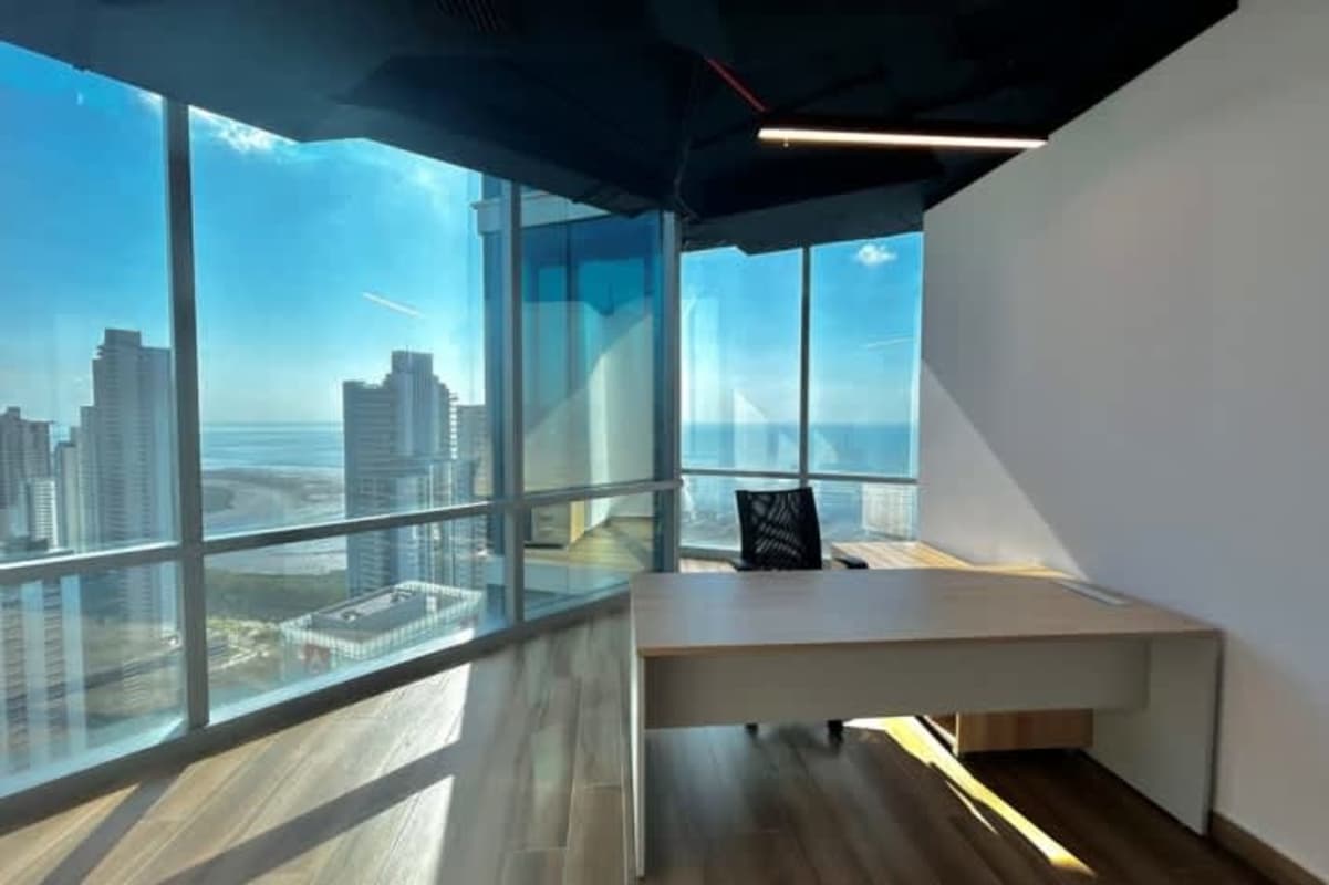 Private executive corner office with floor-to-ceiling windows and city ocean view Panama