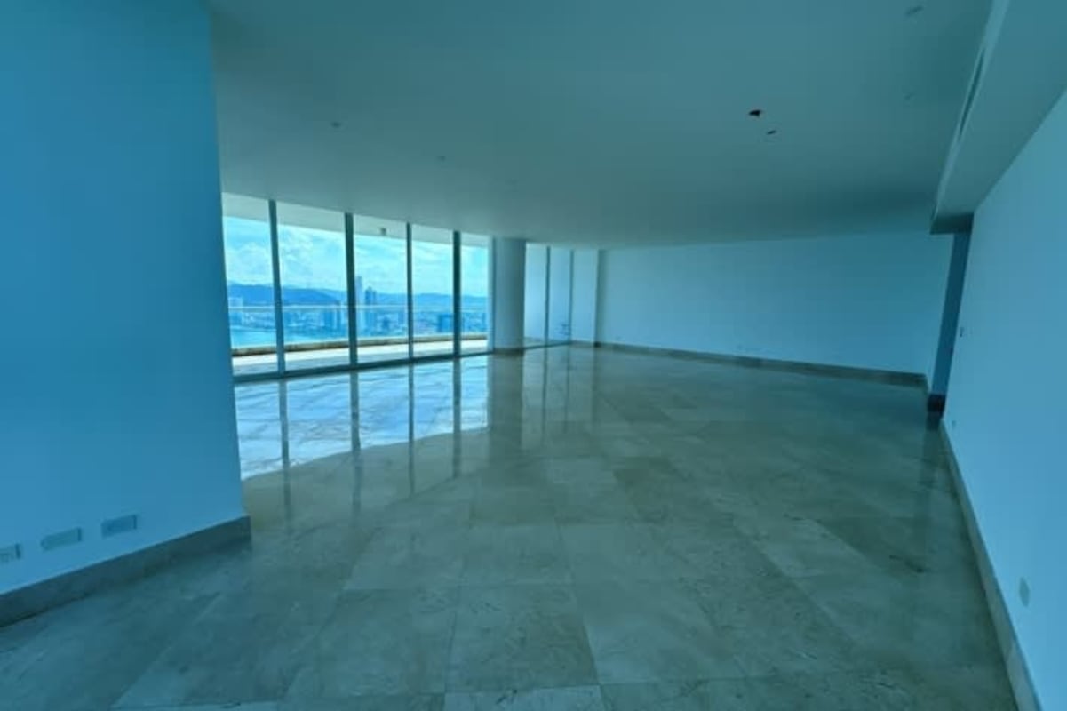 Luxury kitchen with granite island, stainless appliances, ocean view windows in Pacific Point Panama