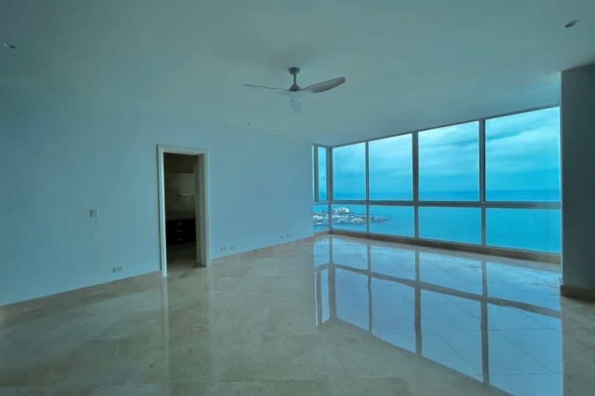 Modern bathroom with marble tiles, double sink vanity, bathtub, glass shower, bay view window Pacific Point Panama