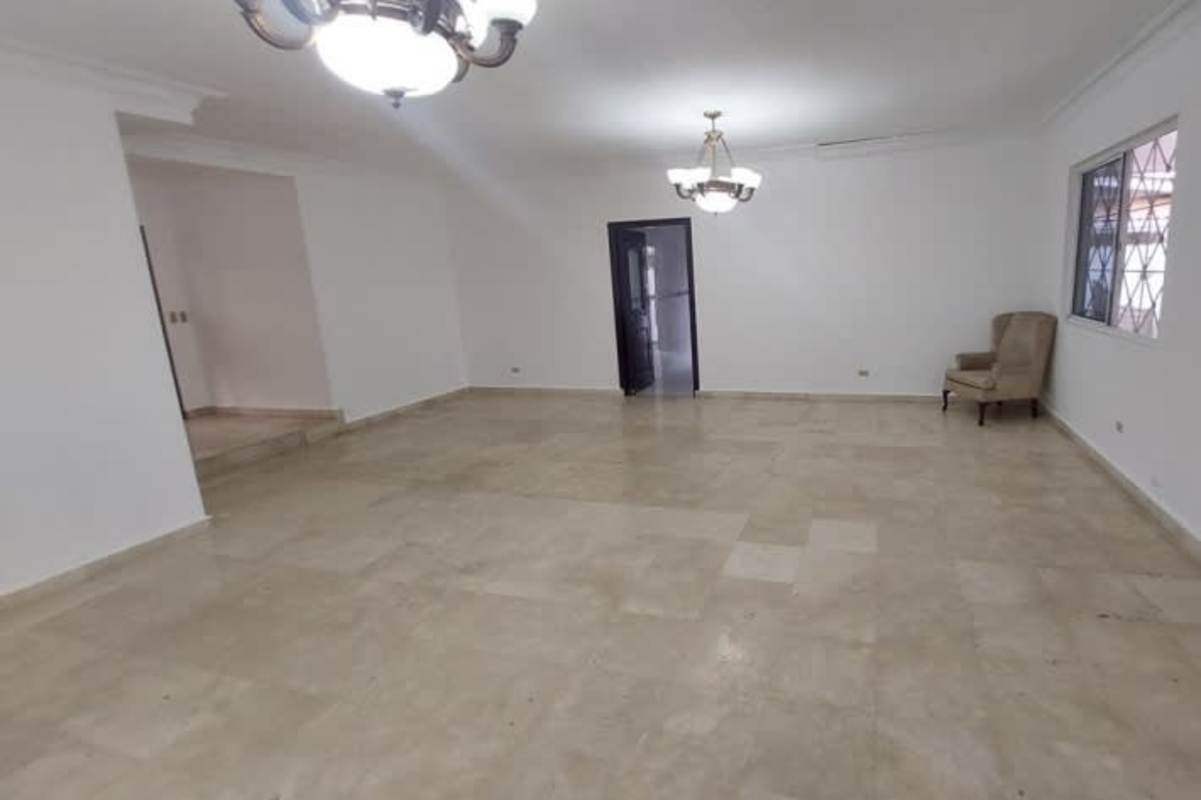 Master bedroom featuring walk-in closet, ceiling fan, large window and AC unit at house in Margarita Colon Panama